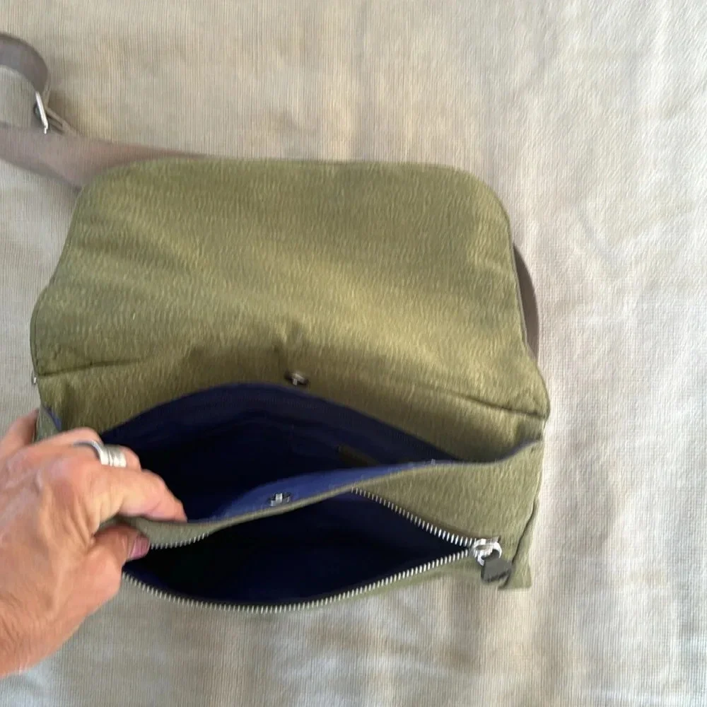 Kipling moss green with colbalt blue lining crossbody bag